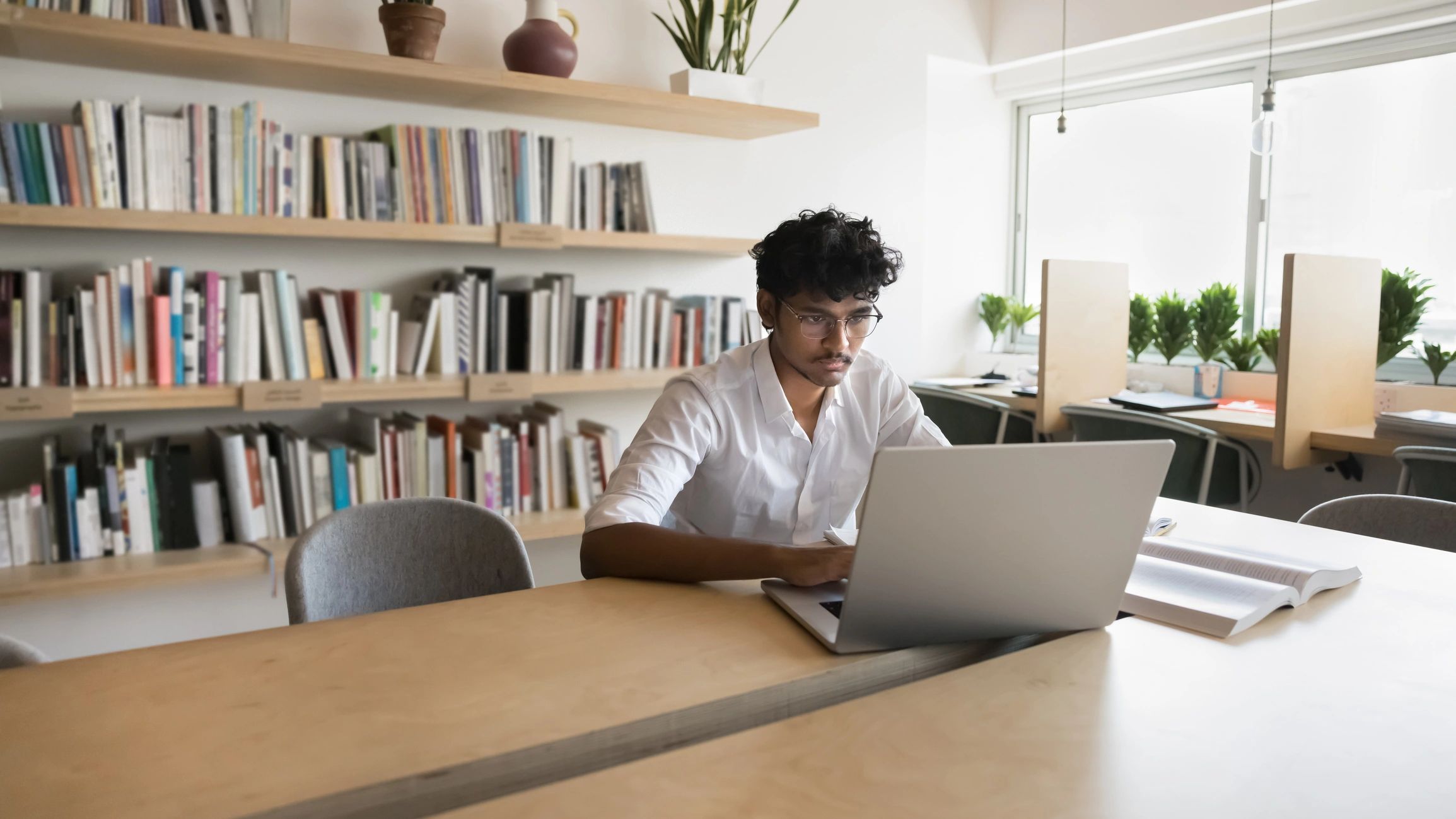 Student working on education planning at a desk